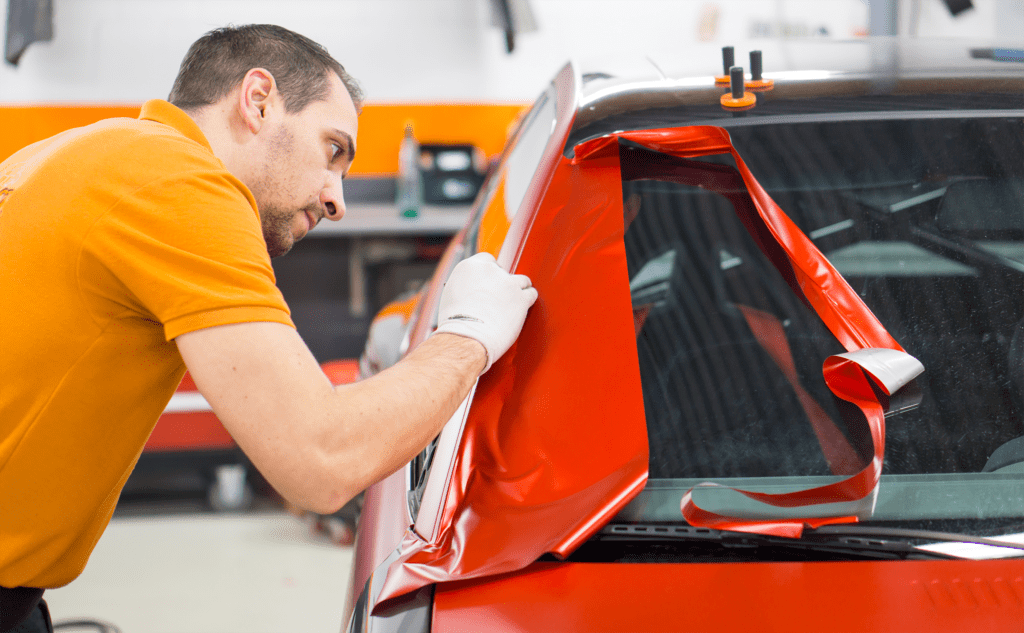 Black Race Car Being Wrapped